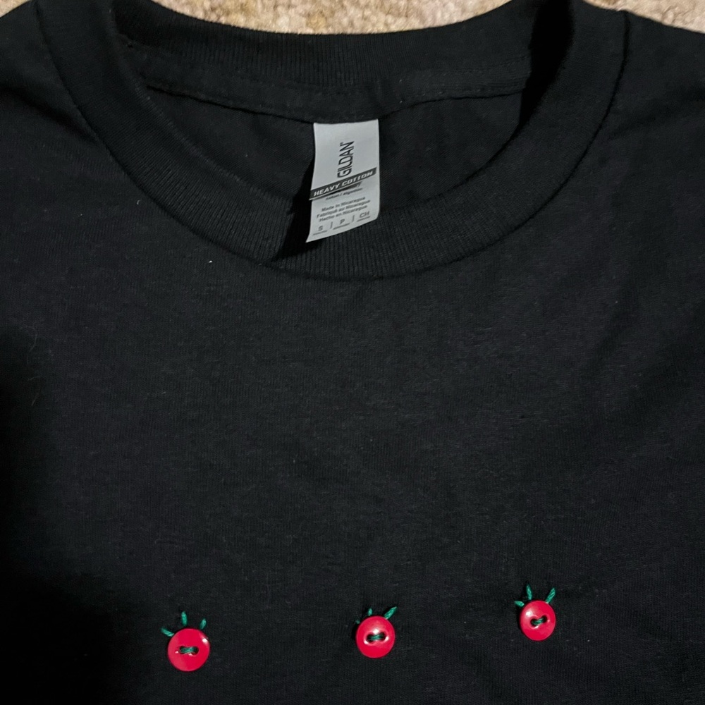 handmade embroidered with buttons, small black T-shirt, cherry tomatoes